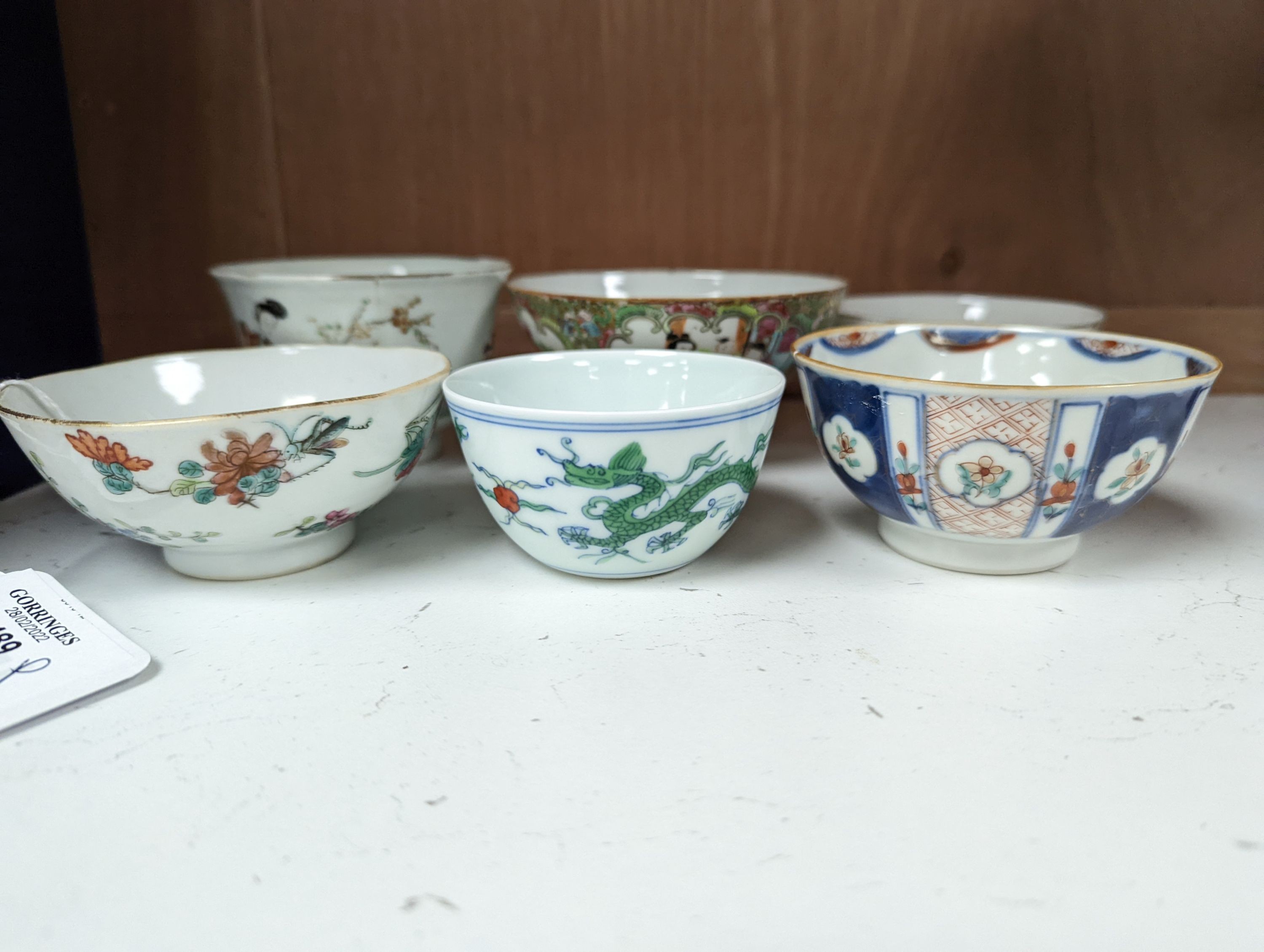 Nine Chinese porcelain tea bowls, tallest 6 cm.